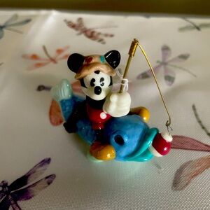 Mickey Mouse sitting on a whale hinged box